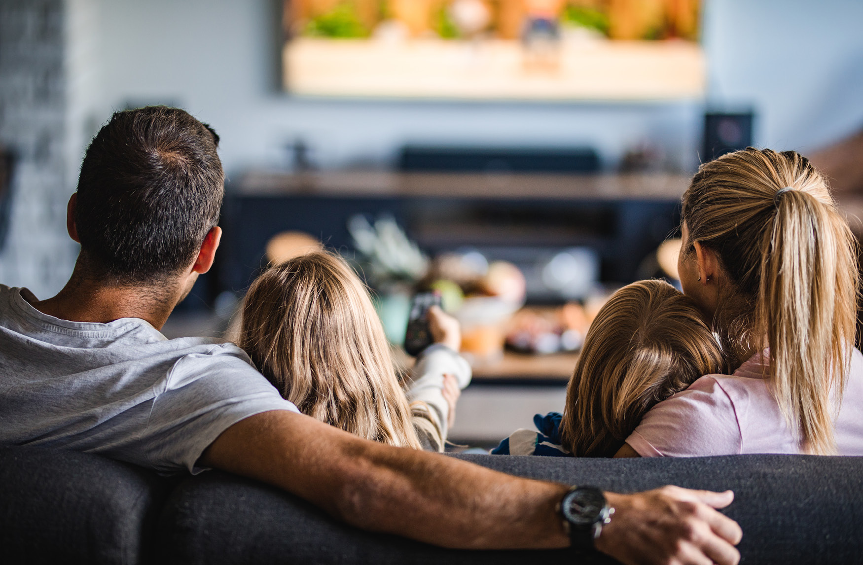 Clearewave Fiber website photography — family watching TV in living room