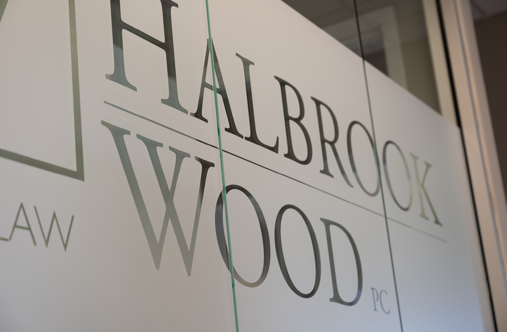 Halbrook Wood logo on conference room window