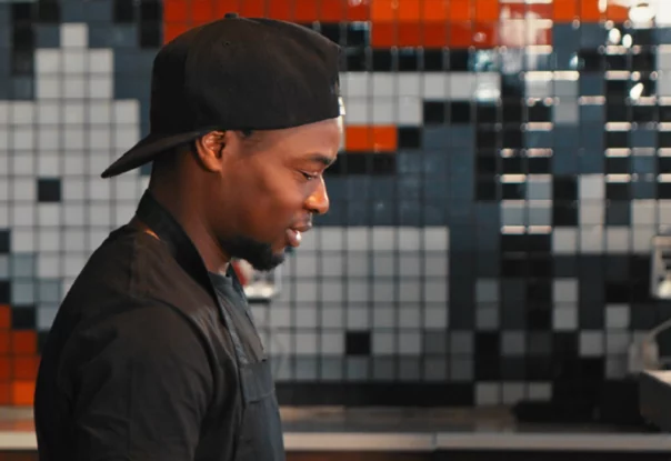 Photo of a man working in a restaurant kitchen